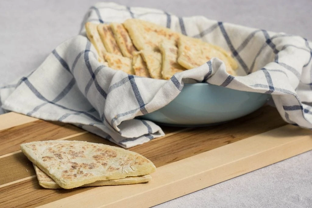Traditional Scottish Tattie Scones Recipe presented on chopping board and bowl