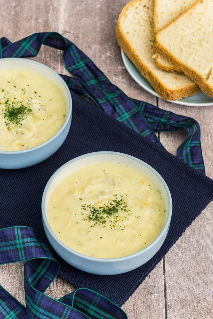 Cullen Skink Recipe - Traditional Scottish Smoked Fish Soup - Two bowls of Cullen Skink with bread