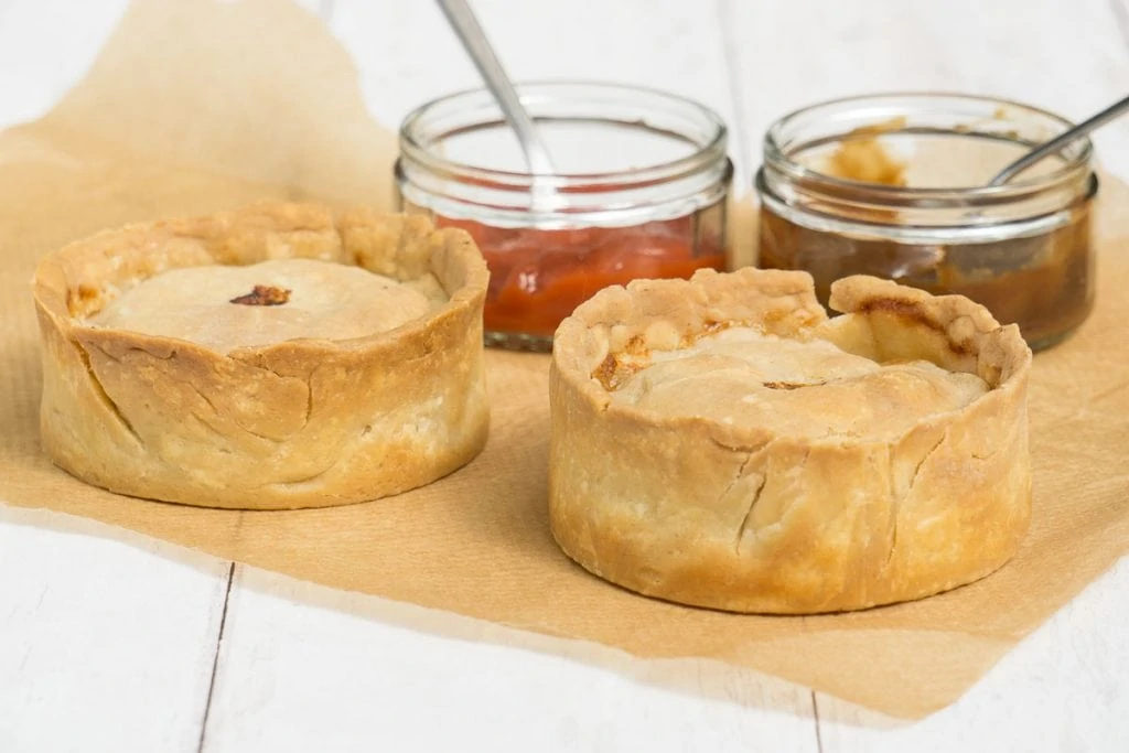 Scotch Pies with brown sauce and red sauce