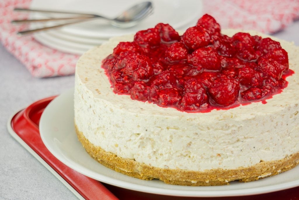Cranachan Cheesecake Recipe - Cranachan Cheesecake on a plate topped with raspberries