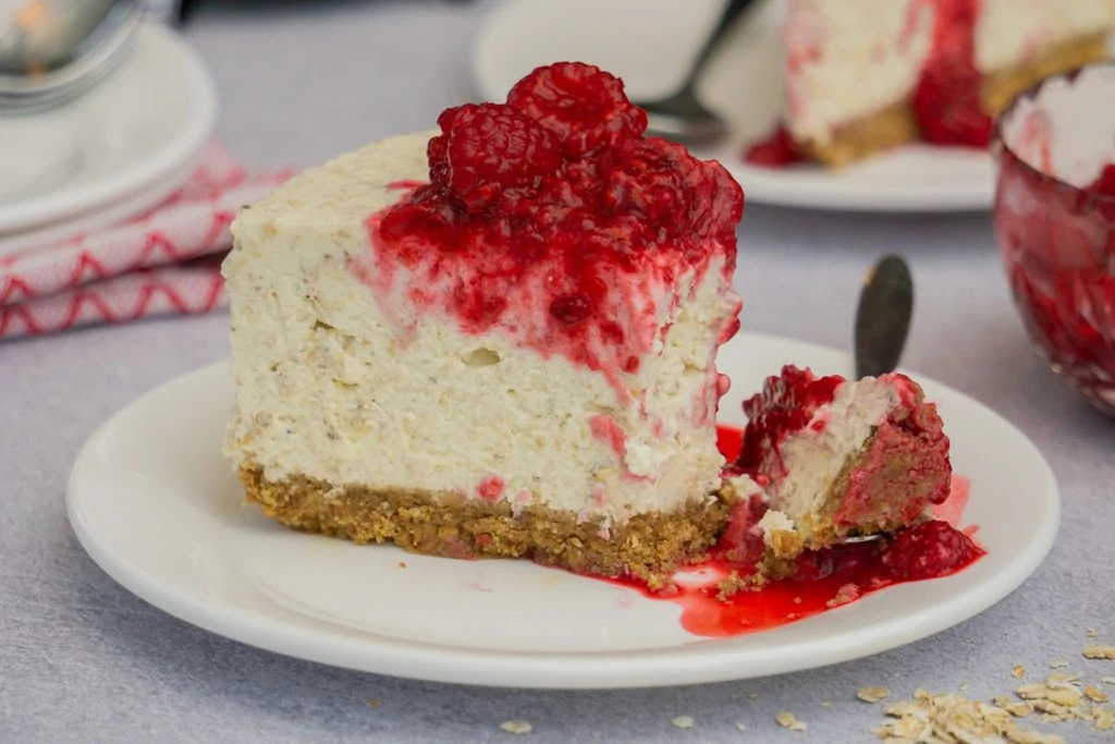 Slice of Scottish Cranachan Cheesecake on a plate with fork