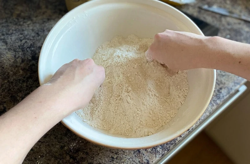 Mixing flour and butter for Flies' Graveyard Recipe