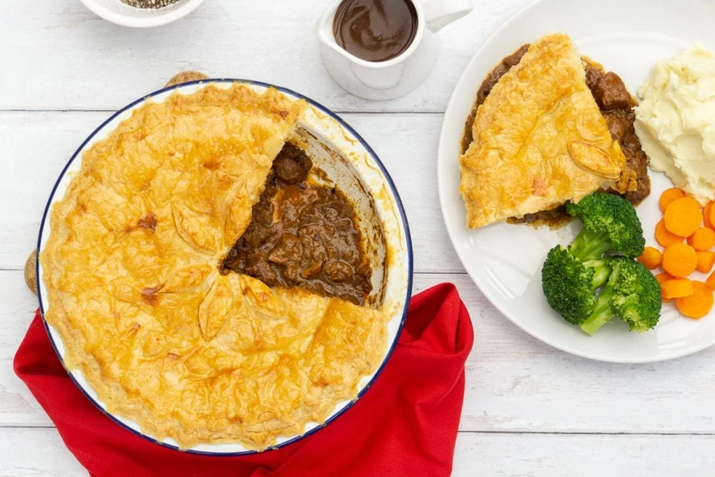 Scottish Steak Pie Recipe in dish and on plate with vegetables