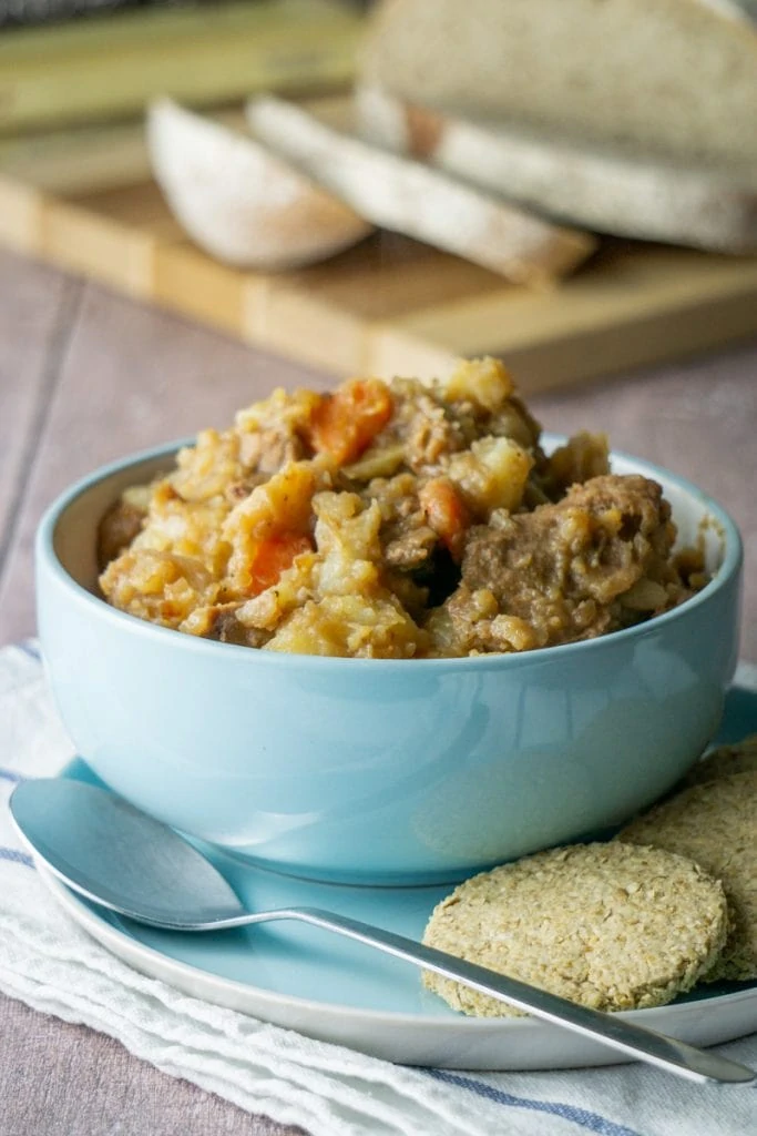 Scottish Stovies Recipe in a bowl with oatcakes on the side