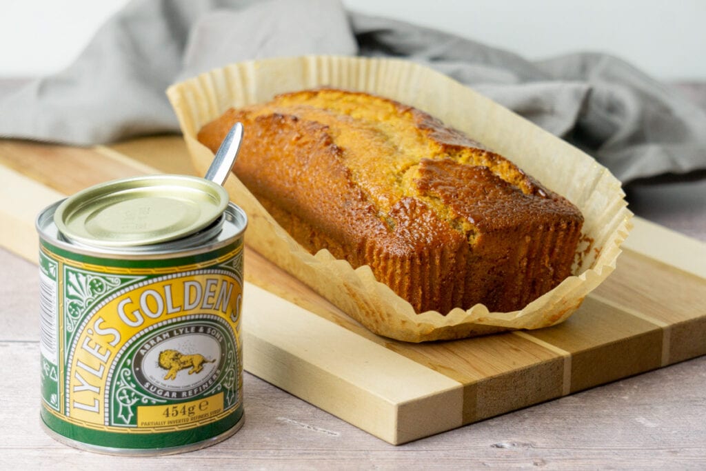 Golden Syrup Cake next to tin of Golden Syrup