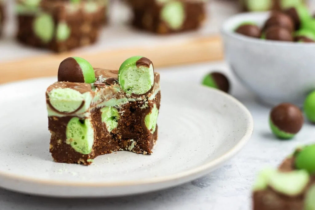 Mint Aero Traybake Slice Recipe with a bite out of it on a plate