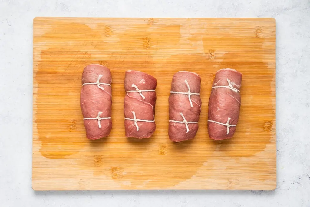 Beef Olives Recipe - Wrapped and tied on a chopping board