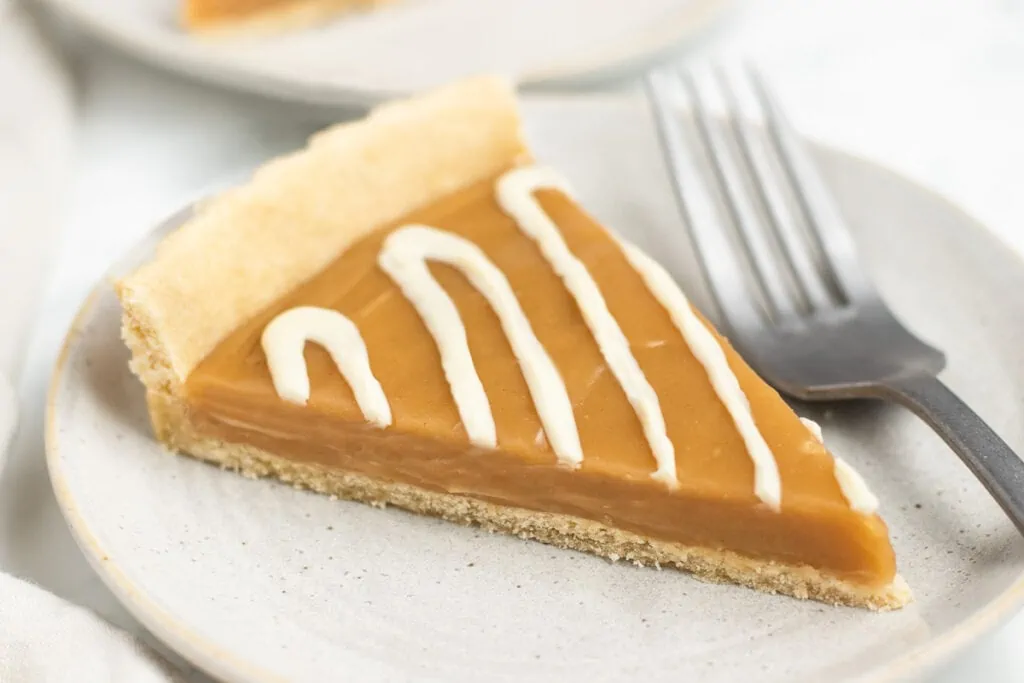 Butterscotch Tart Recipe one slice with a fork on a plate