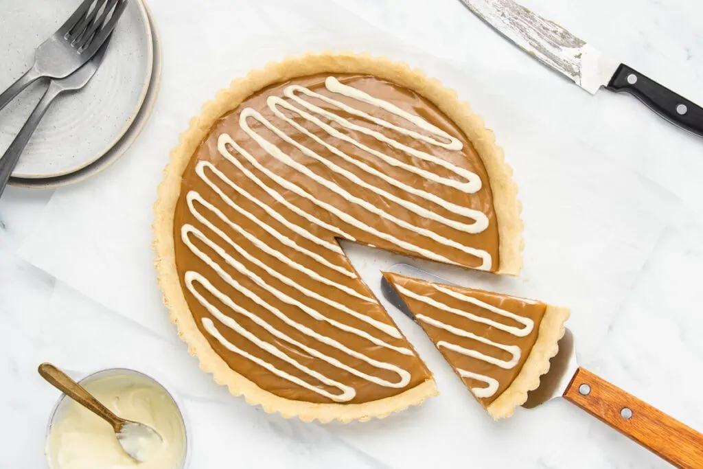 Butterscotch Tart Recipe from top down with one slice cut