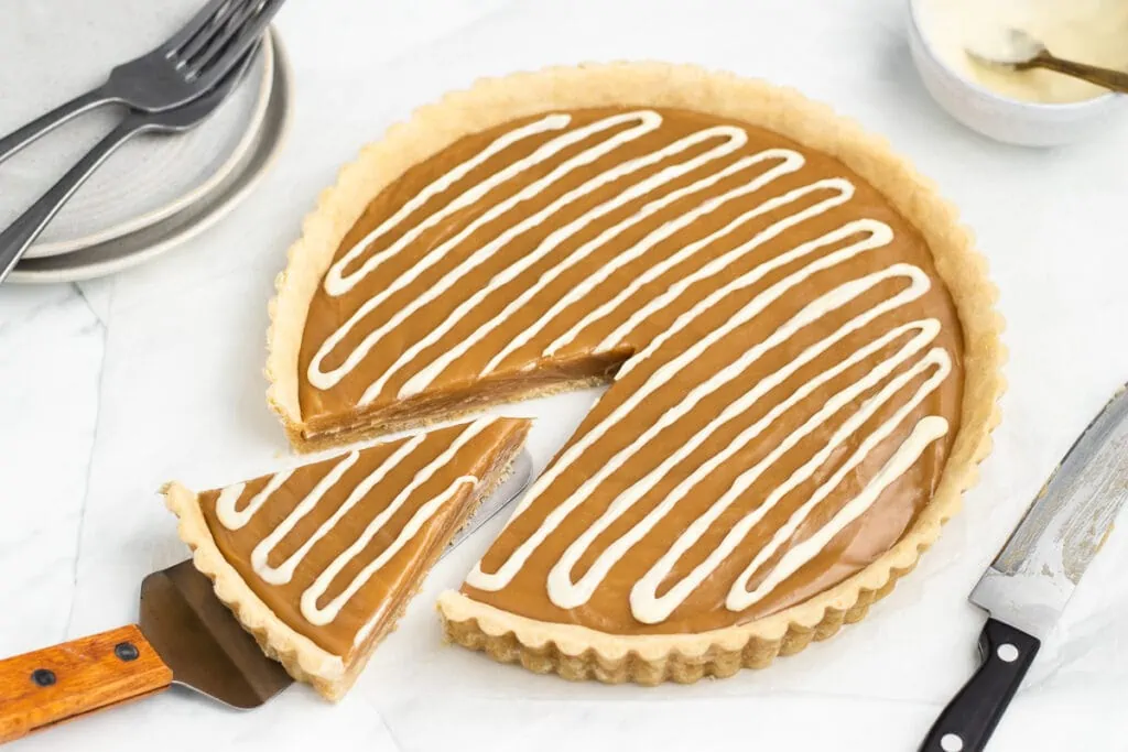 Butterscotch Tart Recipe - One slice being removed