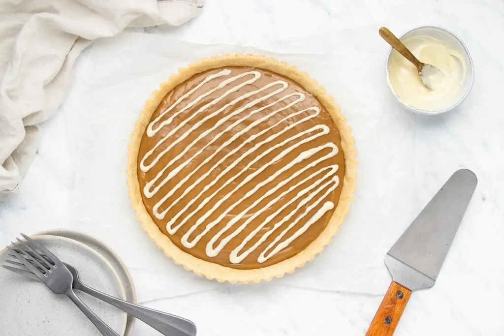 Butterscotch Tart Recipe decorated with white chocolate