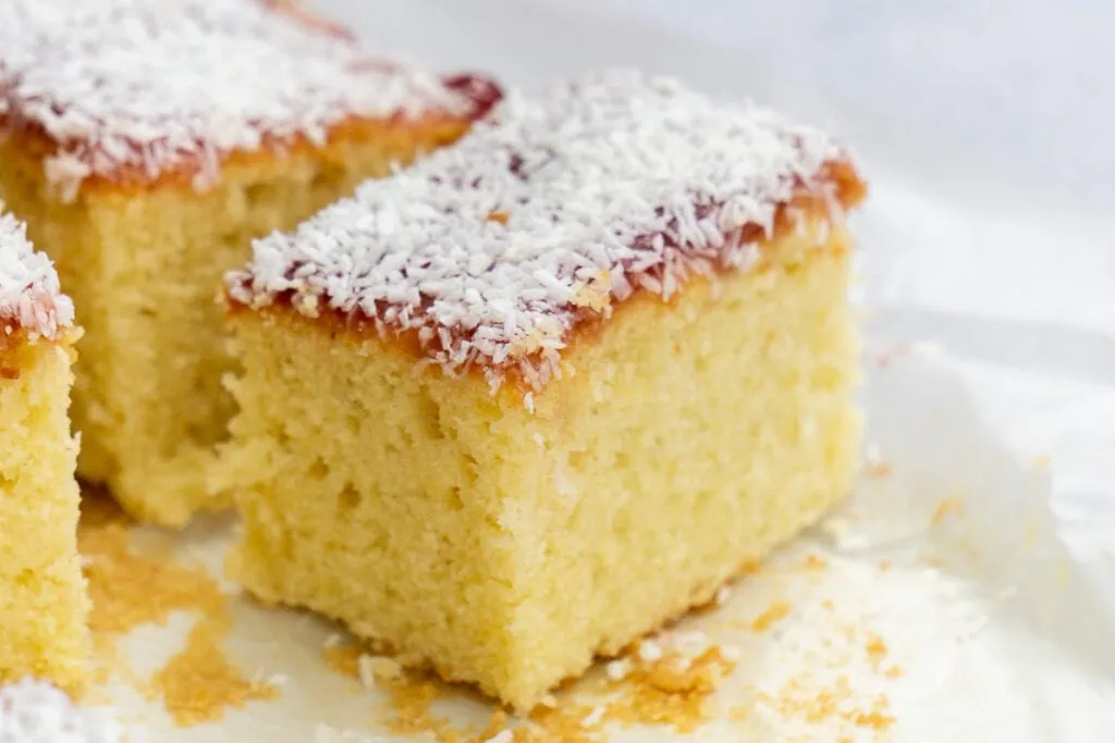 Jam and Coconut Sponge Traybake Recipe one slice