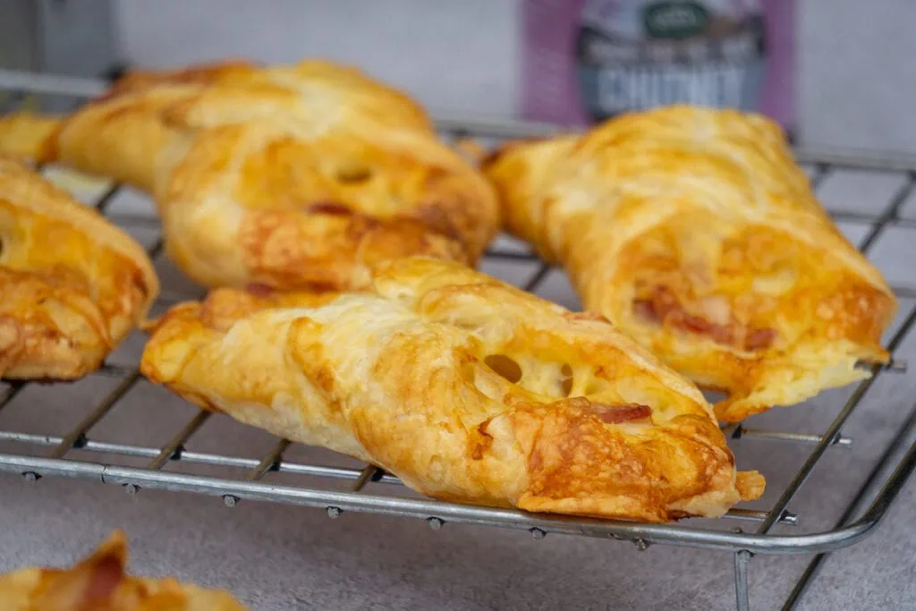 Cheese and bacon turnovers on a wire rack