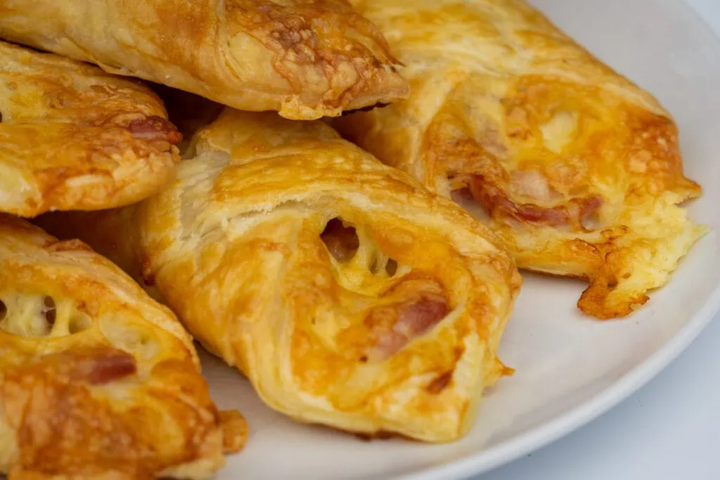 turnovers piled on a white plate