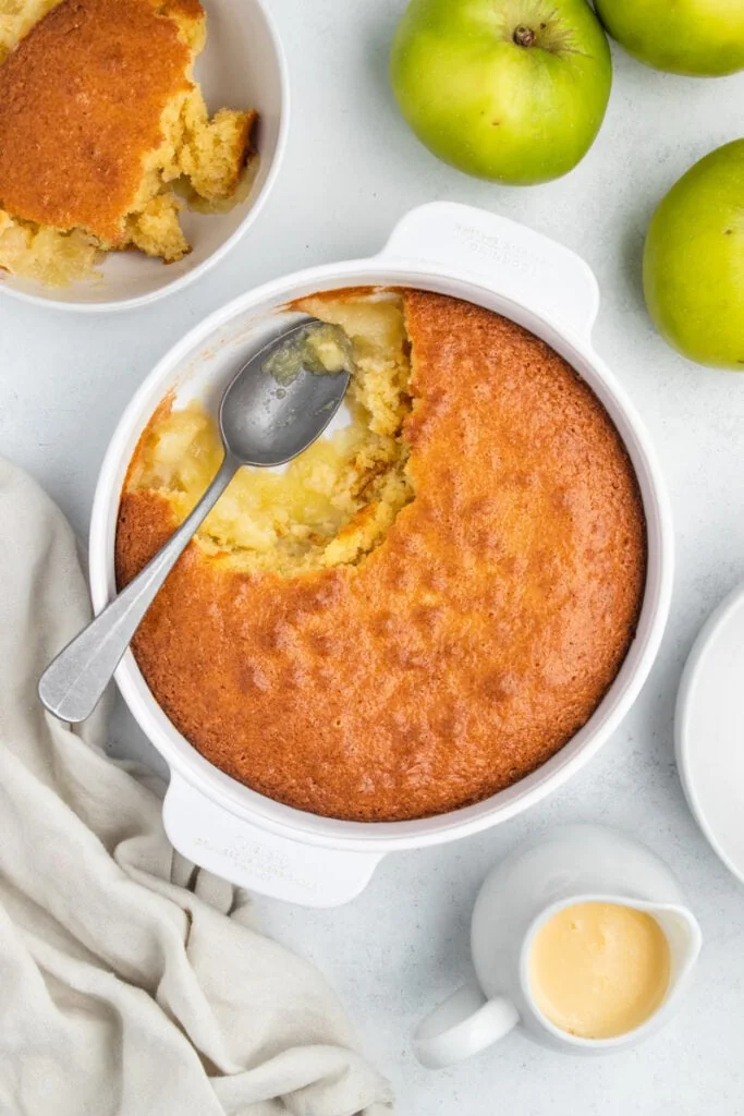 Eve's Pudding Apple Sponge Recipe - top down of pudding with spoon in it