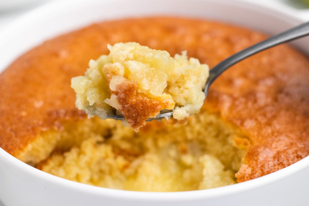 Eve's Pudding Apple Sponge Recipe - On a spoon close up