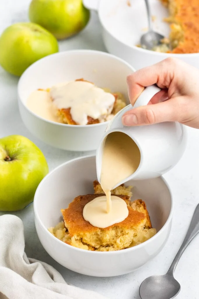 Eve's Pudding Apple Sponge Recipe -  pouring custard on