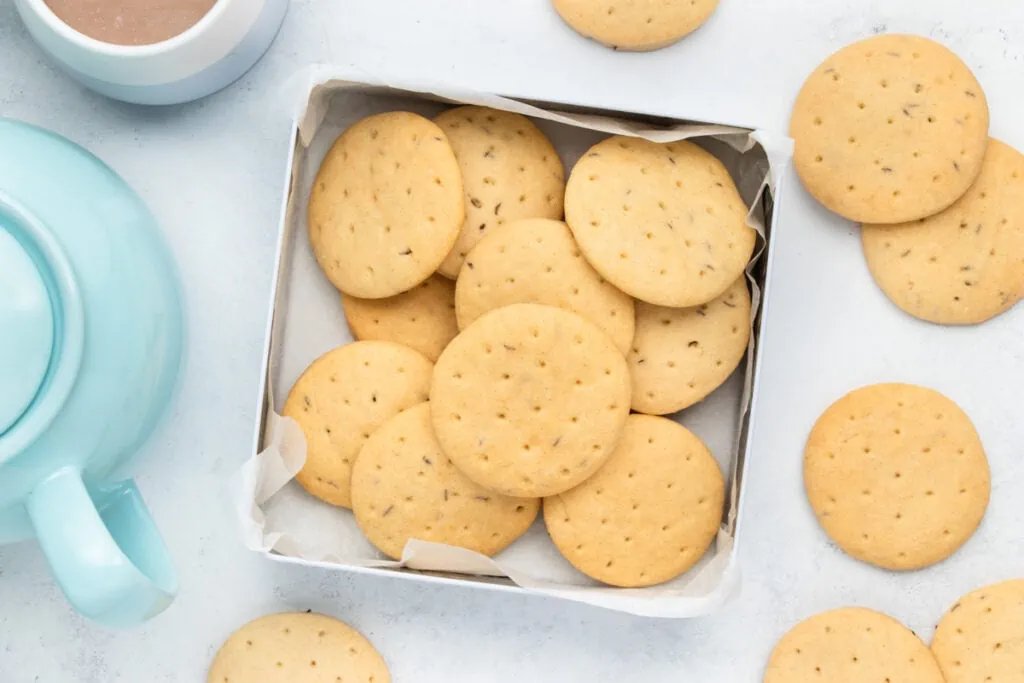 Abernethy Biscuits Recipe - Biscuits in a tin with cup and pot of tea