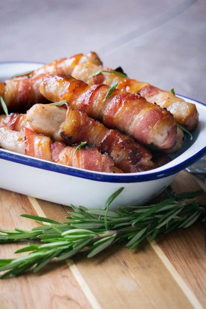 Kilted Soldiers / pigs in blankets with a glaze and sprig of rosemary