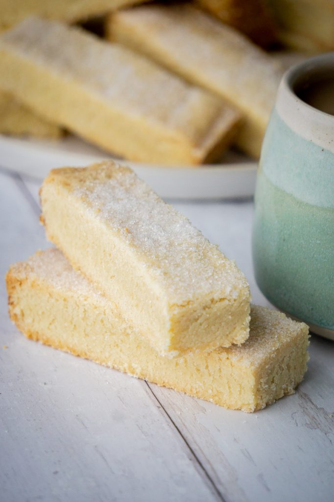 Classic Butter Shortbread Fingers Recipe - next to a mug of tea